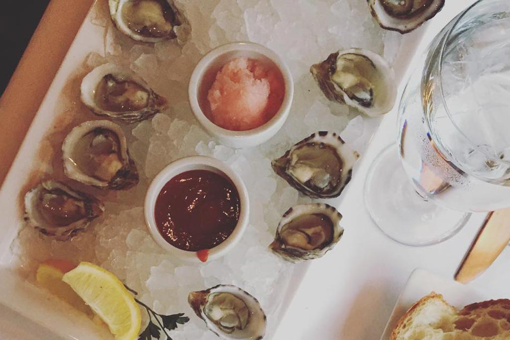 Paired with an expertly crafted cocktail, the Brooklyn's oysters are the perfect refreshment. Credit: janettauh