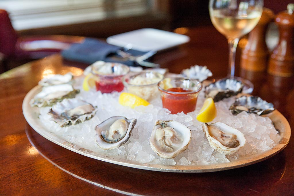 A former 1930's haberdashery, Shuckers is one of our favorite spots for briny bivalves. Credit: The Fairmont Olympic Hotel