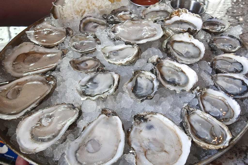 A platter of oysters is the perfect complement to freshly poured pints.