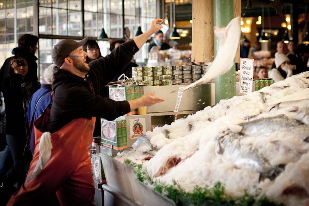 Watch Pike Place Market’s famous fish throwers toss the catch of the day through the air as you stroll through the vibrant landmark. Credit: Savor Seattle
